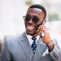 African american business model with phone African american business model with phone